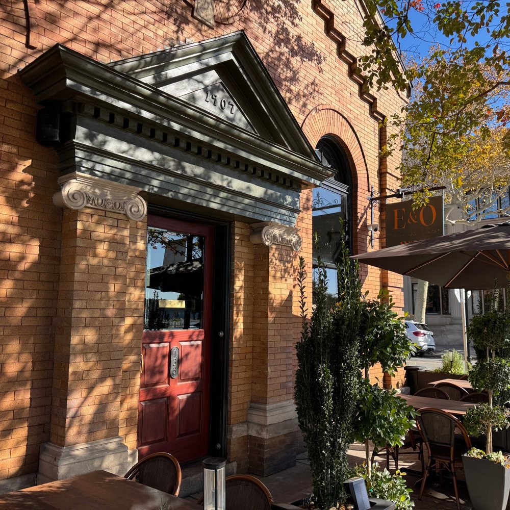 The 1907 brick entrance and sidewalk patio of E&O Pub on Mason Avenue